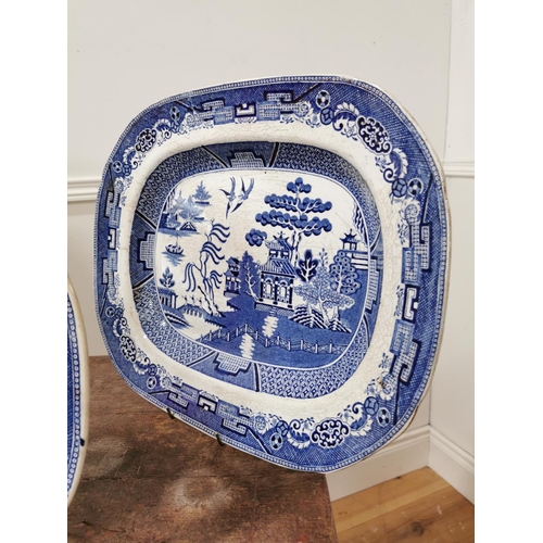 94 - Three 19th C. Blue and White Willow pattern platters {46cm L x 39cm W Largest / 40cm L x 33cm W Smal... 