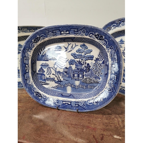 94 - Three 19th C. Blue and White Willow pattern platters {46cm L x 39cm W Largest / 40cm L x 33cm W Smal... 