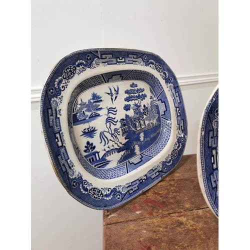 94 - Three 19th C. Blue and White Willow pattern platters {46cm L x 39cm W Largest / 40cm L x 33cm W Smal... 