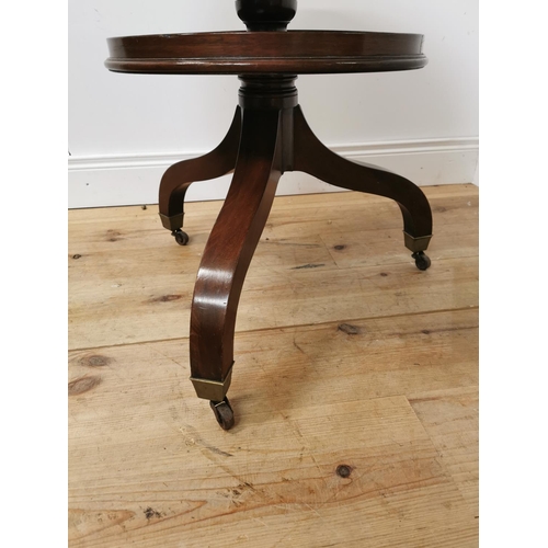 972 - Georgian mahogany two tier dumb waiter raised on turned column and three outswept legs { 75cm H X 56... 