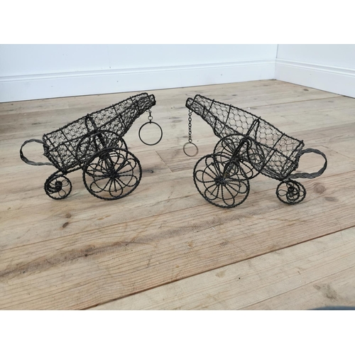 678 - Two early 20th C. wire wine bottle carriers {23 cm H x 33 cm W x 16 cm D}.