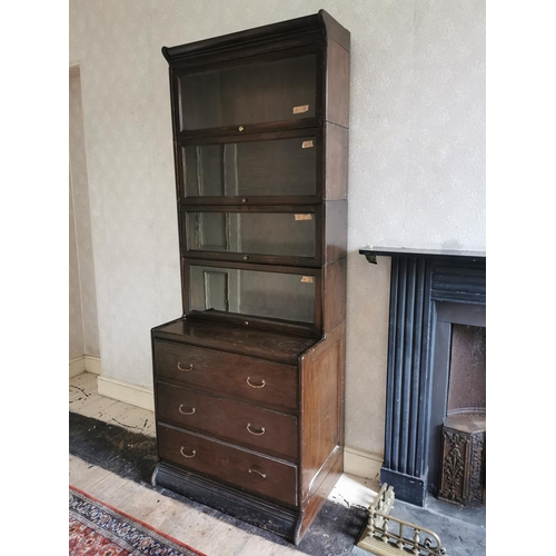 759 - Pair of 1940s oak stackable book cases with four glazed doors above four panelled doors {231 cm H x ... 