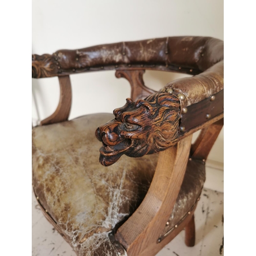 766 - 19th C. upholstered leather carved oak desk chair decorated with lions masks raised on turned legs {... 