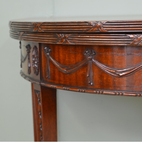 884 - 19th C. mahogany demi - lune turn over leaf games table raised on square tapered legs and spade feet... 