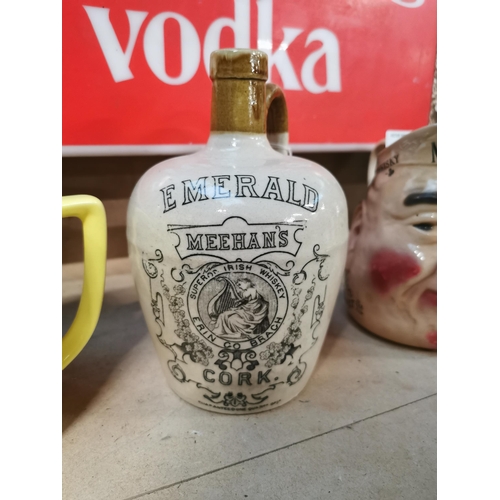 104 - Emerald Meehan's Cork stoneware advertiisng whiskey flagon {18 cm H x 12 cm Dia.}.