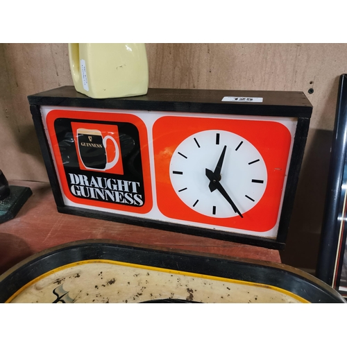 125 - Draught Guinness perspex and wood battery operated advertising Clock. {20 cm H x 37 cm W x 9 cm D}.