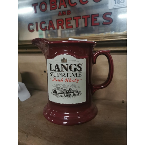 186 - Lang�s Supreme Scotch Whiskey ceramic advertising water jug. {14 cm H x 17 cm W x 10 cm D}.