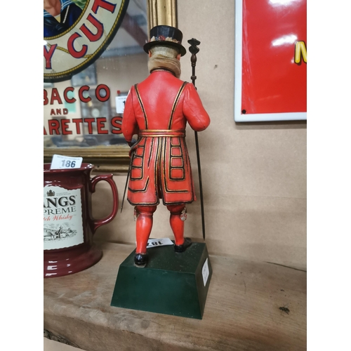 187 - Beefeater London Gin perspex advertising figure. {30 cm H x 10 cm W x 10 cm D}.