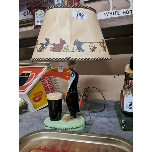 189 - Guinness Toucan ceramic advertising lamp with original shade {43 cm H x 32 cm W x 20 cm D}.