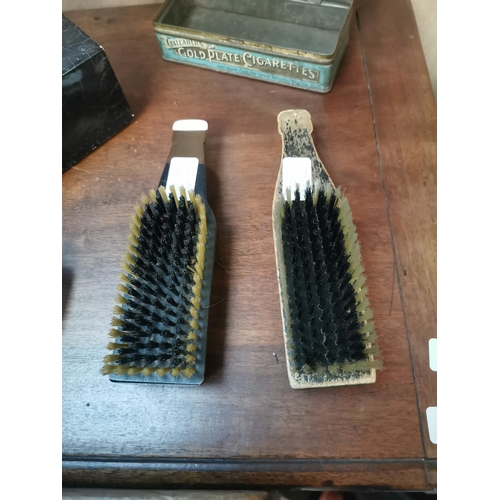 226 - Two wooden Guinness bottles in the form of brushes. {20 cm H x 6 cm W}.