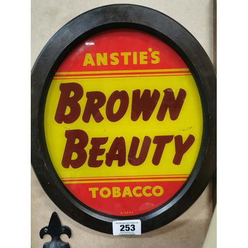 253 - Anstie's Brown Beauty Tobacco reverse painted glass advertising sign {36 cm H x 31 cm W}.