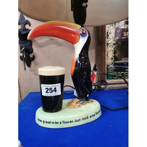 254 - Guinness Toucan ceramic advertising lamp with original shade {43 cm H x 29 cm W}.