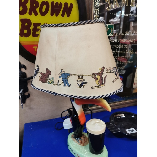 254 - Guinness Toucan ceramic advertising lamp with original shade {43 cm H x 29 cm W}.