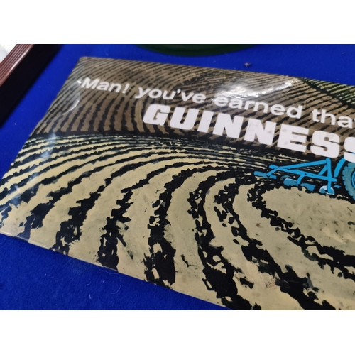 288 - Celluloid Man you�ve earned that Guinness advertising showcard. {15 cm H x 30 cm W}.