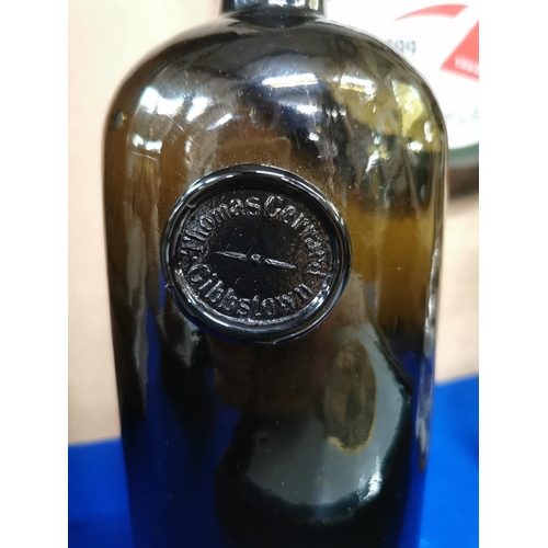 291a - Thomas Gerrard Whiskey black glass advertising bottle. {27 cm H x 11 cm W}