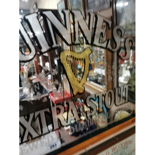 293 - Guinness Extra Stout brewed in Dublin and London framed advertising mirror. {68 cm H x 84 cm W}.