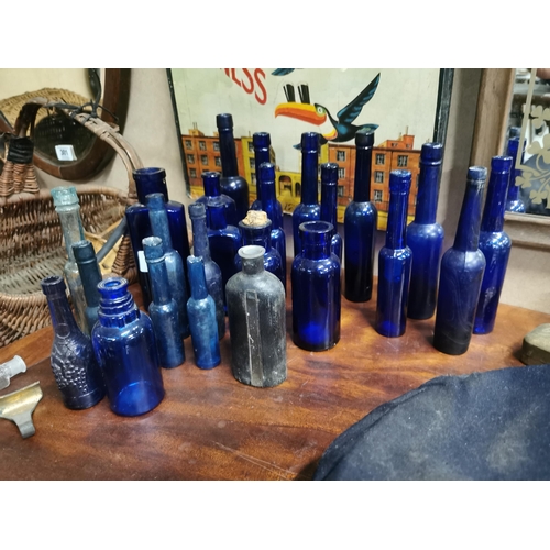 310 - Collection of 24 19th C. blue poison and castor oil bottles.