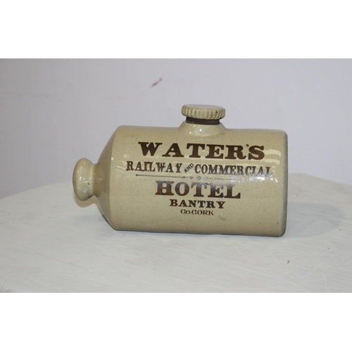 341 - Water's Railway and Commerical Hotel Bantry Cork stoneware hot water bottle. {12 cm H x 22 cm W}.