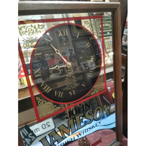 347 - John Jameson Irish Whisky battery operated framed advertising clock.  {50  cm H x 34 cm W}.