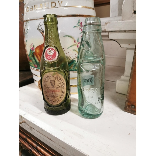 365 - Early 20th C. Guinness Extra Stout glass bottle and Kenman of Dublin glass bottle.