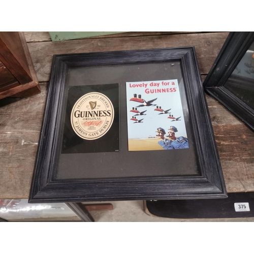 379 - TwoGuinness postcards framed . {32 cm H x 32 cm W}.