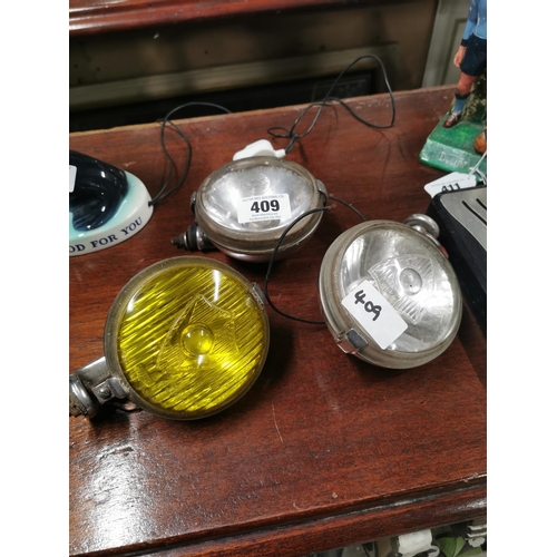 409 - Three 1960�s metal spot lamps for cars.