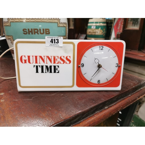 413 - Guinness Time Perspex advertising clock {13 cm H x 30 cm W x 18 cm D}.