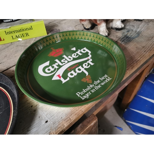 485 - Guinness tin plate advertising drink�s tray and Carlsberg tin plate drink�s tray . {30 cm Dia}.