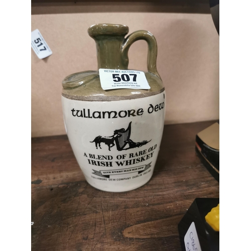 507 - Tullamore Dew stoneware flagon. 18 cm H x 12 cm Dia}.