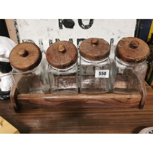 550 - 1950�s Set of four glass sweet jars on wooden stand. Jars {25 cm H x 20 cm x 10 cm D} Stand {17 cm H... 