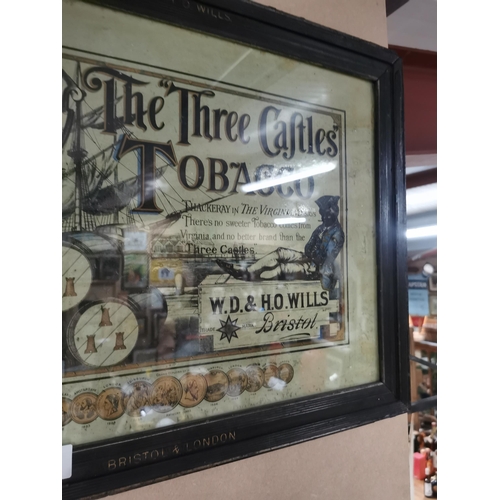 618 - The Three Castles Tobacco W.D. & H.O. Wills Bristol advertising showcard in original frame. { 45cm H... 