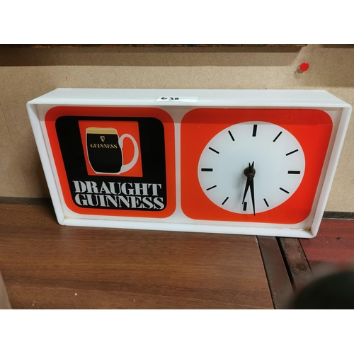 638 - Draught Guinness perspex advertising clock { x 36 cm W x 7 cm D}.