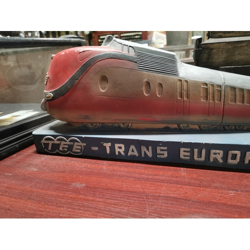 722 - Model of TEE Trans Europ Express Train. {30 cm H x 69 cm W x 10 cm D}.