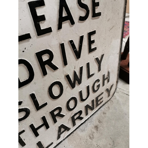 730 - Alloy sign � Please Drive Slowly Through Blarney. {92 cm H x 62 cm W}.