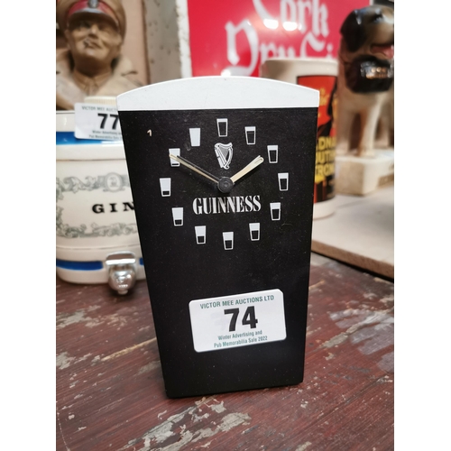 74 - Wooden Guinness advertising clock in form of pint glass. {15 cm H x 10 cm W x 6 cm D}.