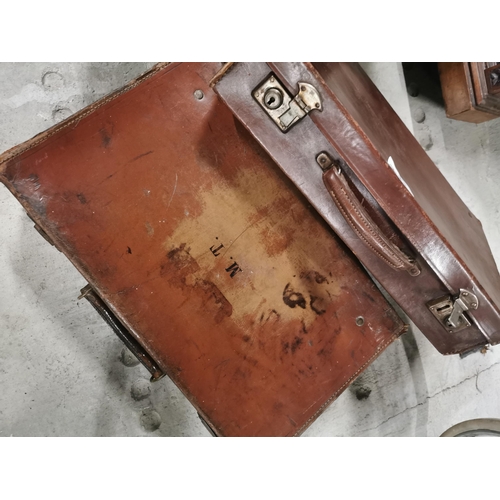 747 - Two Leather suitcases. {9 cm H x 45 cm W x 29 cm D}