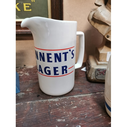 75 - Tennants Lager Wade pottery ceramic advertising water jug. {15 cm H x 14 cm W x 9 cm D}.