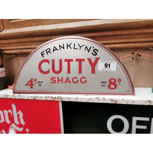 91 - Franklyn�s Cutty Shag tin plate advertising sign. {17 cm H x 39 cm W}.