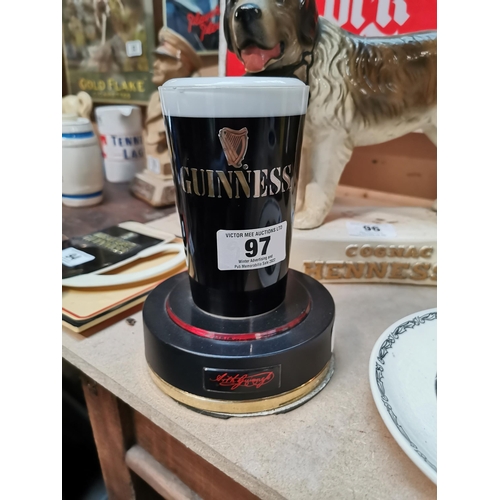 97 - Guinness Perspex advertising counter light. {19 cm H x 14 cm Dia}.