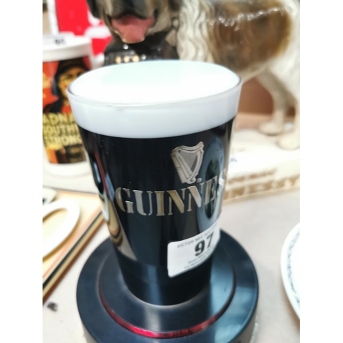 97 - Guinness Perspex advertising counter light. {19 cm H x 14 cm Dia}.