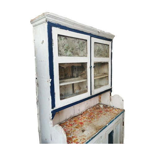 749a - Painted pine dresser, the superstructure with two glazed doors enclosing shelves above a bread board... 