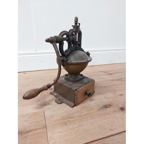 113 - Early 20th C. cast iron and copper coffee grinder {34 cm H x 36 cm W x 20 cm D}.