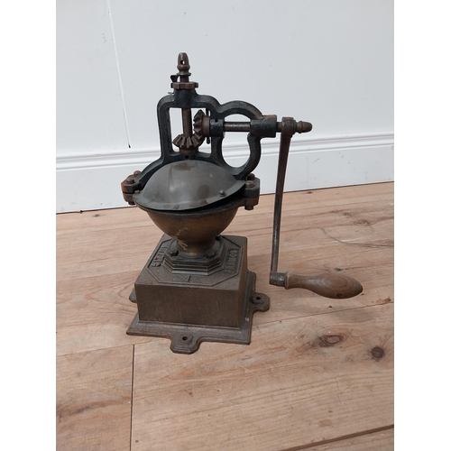 113 - Early 20th C. cast iron and copper coffee grinder {34 cm H x 36 cm W x 20 cm D}.