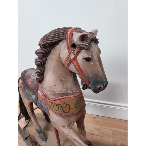 118 - Carved pine and hand painted child's rocking horse {74 cm H x 84 cm W x 25 cm D}.