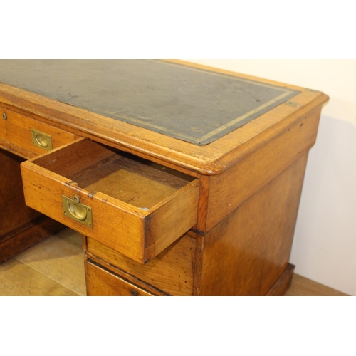 13 - Yew wood partners desk with inset leather top {76 cm H x 137 cm W x 66 cm D}.