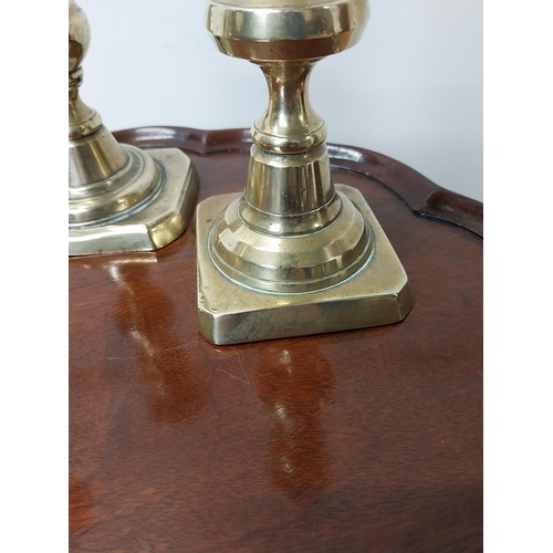 25 - Three 19th C. brass candlesticks {21 cm & 19 cm H}.