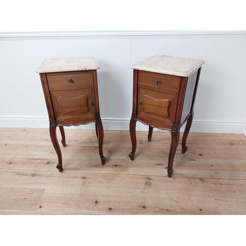52 - Pair of 19th C. mahogany bedside cabinets with single drawer above panel door and marble tops raised... 