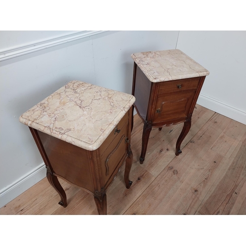 52 - Pair of 19th C. mahogany bedside cabinets with single drawer above panel door and marble tops raised... 