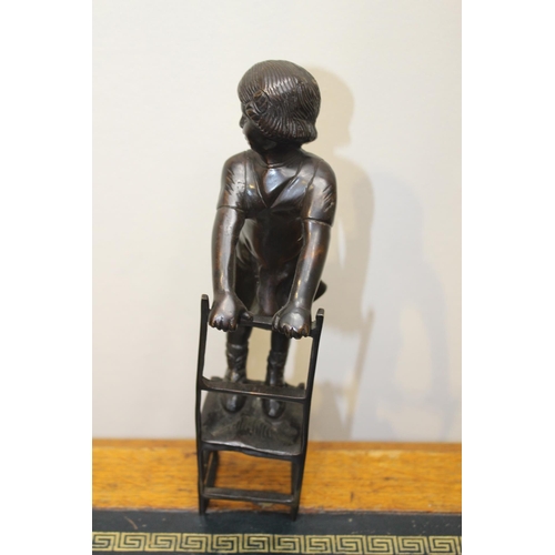 56 - Bronze figure of a Girl {25 cm H x 6 cm W  x 10 cm D}.
