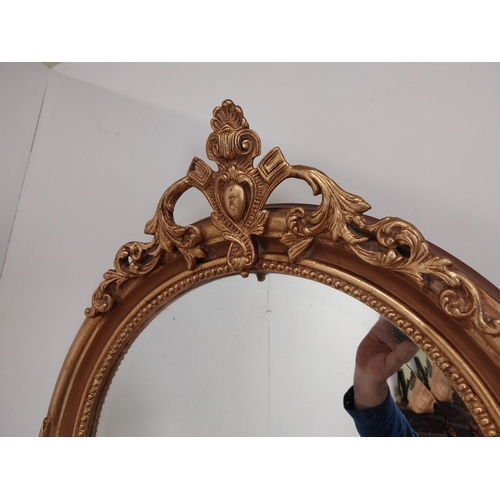 79 - Good quality gilt circular wall mirror with bevelled glass {70 cm H x 60 cm W}.